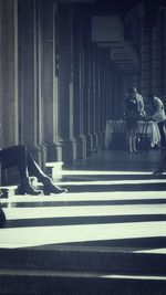 Woman standing by railing