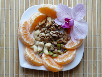 Close-up of fruits in plate on table