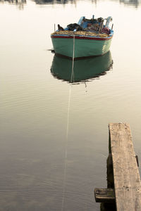Boat moored in lake