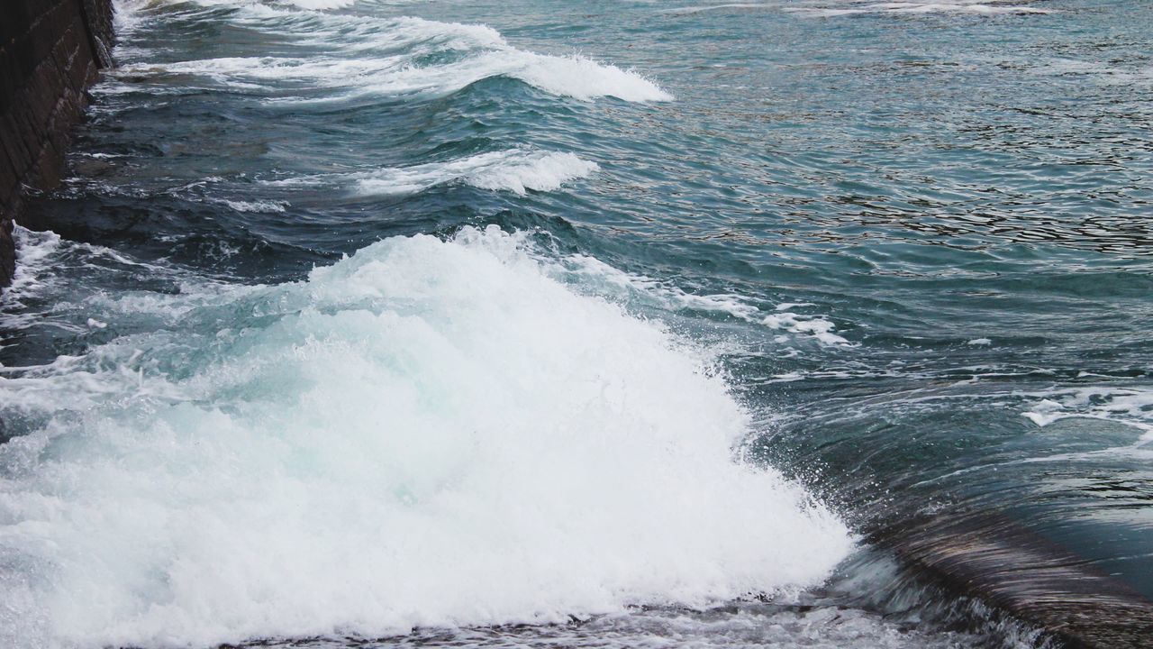 water, sea, surf, wave, motion, splashing, beauty in nature, nature, scenics, power in nature, high angle view, shore, rippled, beach, waterfront, rock - object, day, outdoors, tranquility, tranquil scene