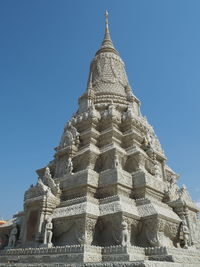 Low angle view of a temple against clear blue sky