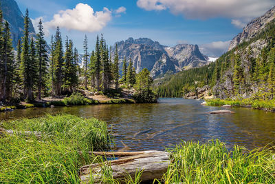 Scenic view of lake and mountains against sky