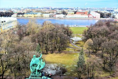 High angle view of trees and buildings in city