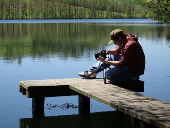 Man taking pictures on jetty