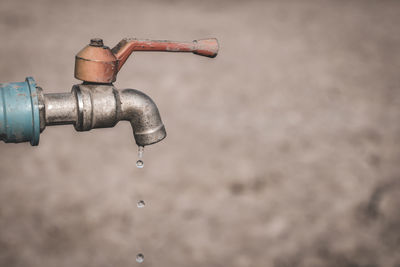 Close-up of water faucet in sea