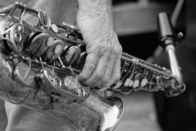 Close-up of hand holding trumpet