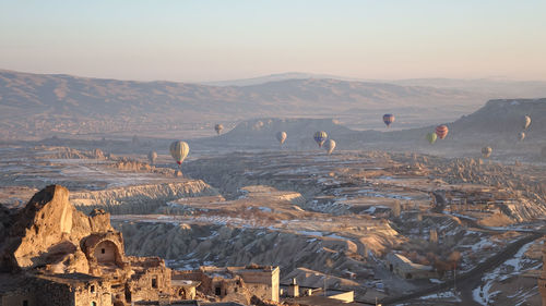 View of hot air balloons on mountain