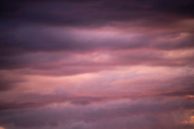 Low angle view of dramatic sky during sunset