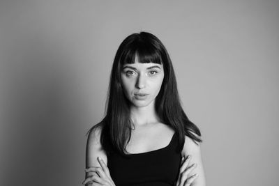 Portrait of woman against white background