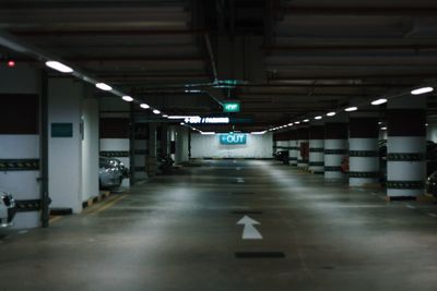 Illuminated underground walkway at night