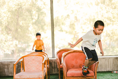 Side view of woman sitting on stage