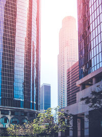 Low angle view of skyscrapers against clear sky