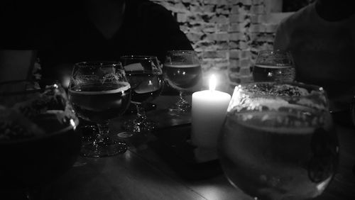 Close-up of illuminated candles on table