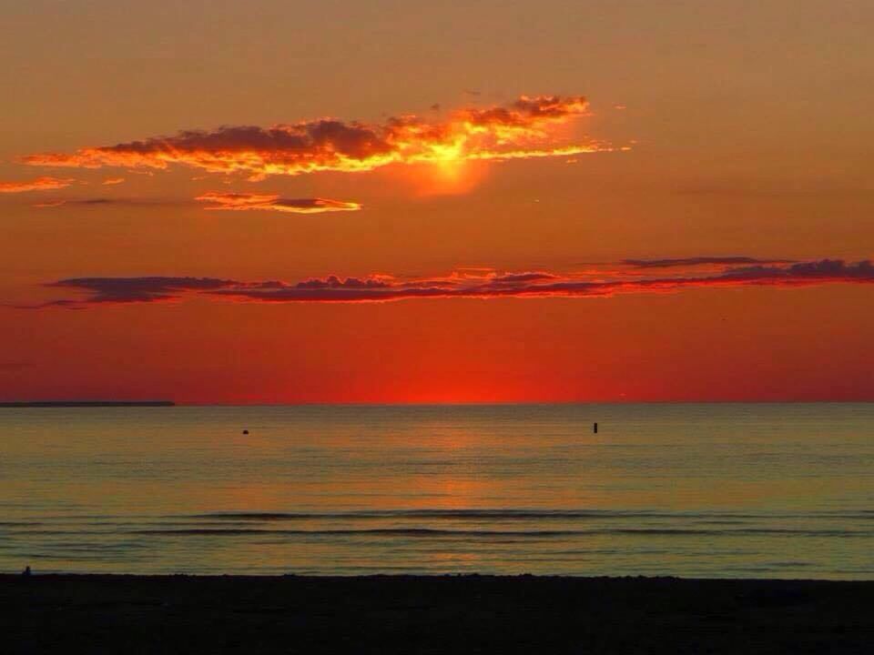 sunset, sea, water, orange color, horizon over water, scenics, beach, tranquil scene, beauty in nature, tranquility, sky, shore, idyllic, sun, nature, silhouette, reflection, remote, outdoors, cloud - sky