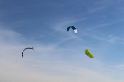 Low angle view of kite flying against sky