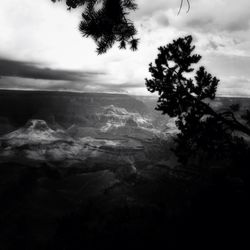 Scenic view of mountains against cloudy sky