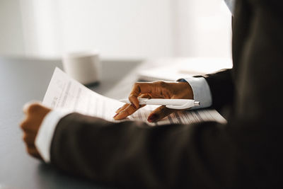 Woman's hands holding documents