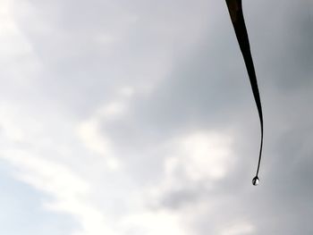 Low angle view of silhouette helicopter against sky