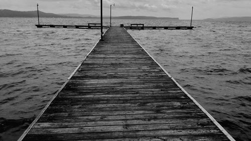 Pier over sea against sky