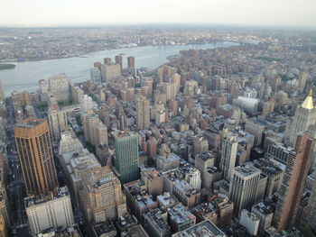 High angle view of modern buildings in city against sky