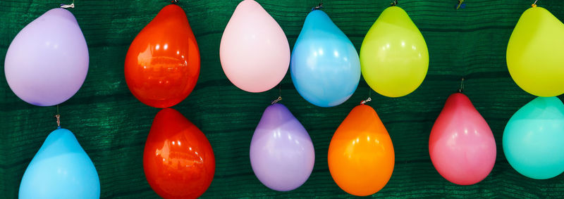 Close-up of multi colored balloons on table