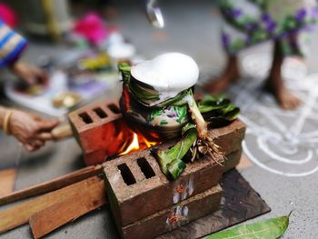 People preparing food on stove