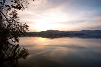 Scenic view of lake against sky during sunset
