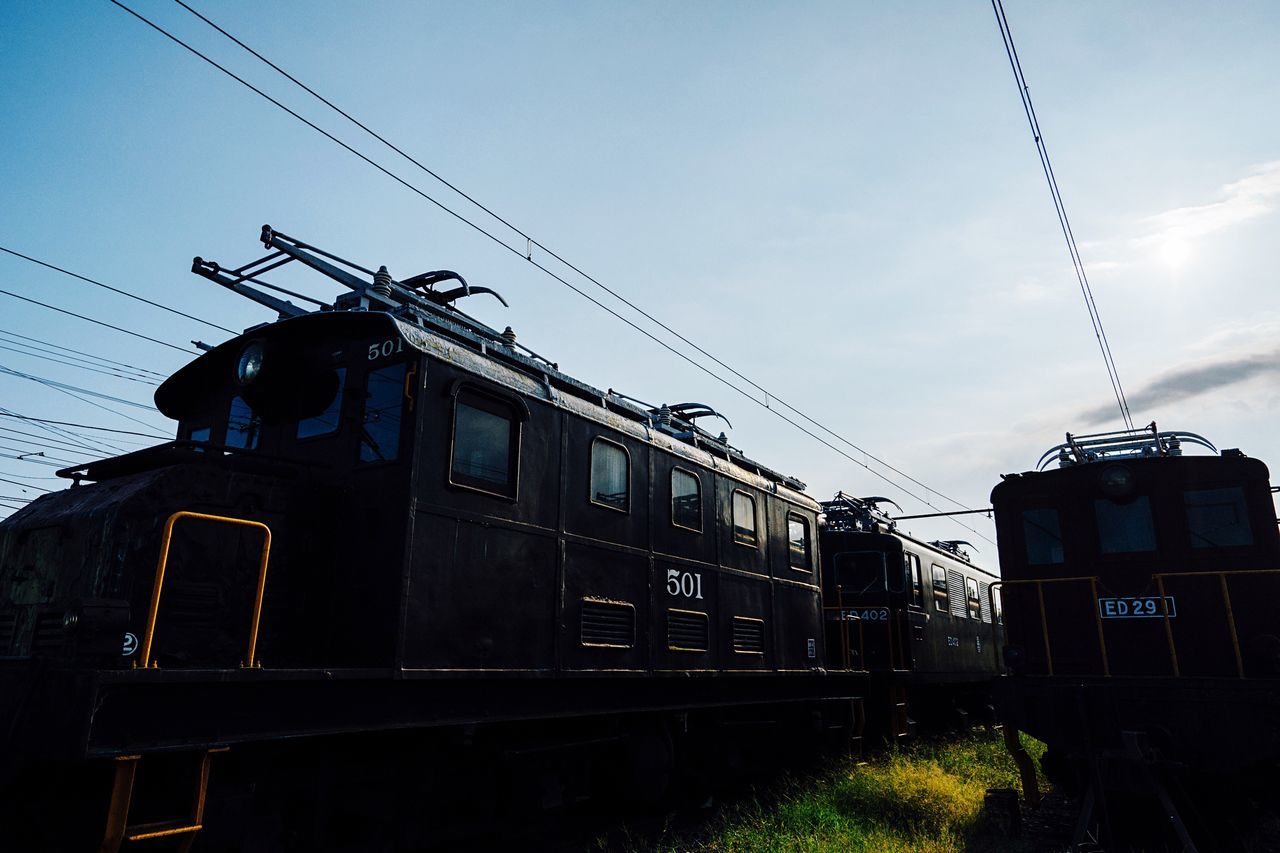 LOW ANGLE VIEW OF TRAIN ON RAILROAD TRACK