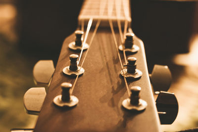 Close-up of guitar on table