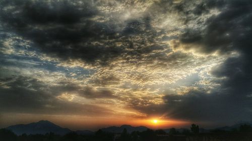 Scenic view of landscape against cloudy sky