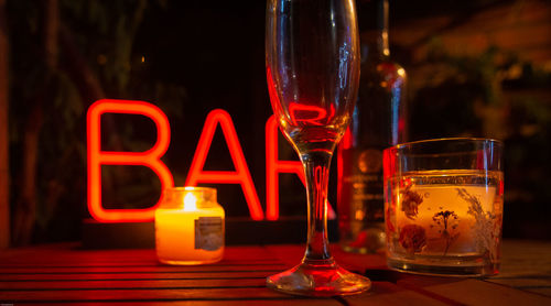 Close-up of wine glasses on table