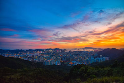 High angle view of buildings against sky during sunset