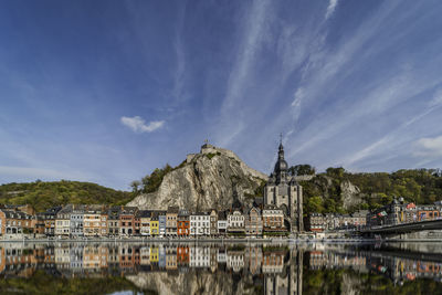 Reflection of the old town dinant during autumn. city landscape in belgium