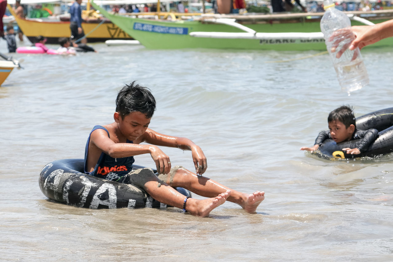 water, men, leisure activity, lifestyles, real people, child, males, waterfront, people, boys, nature, togetherness, day, childhood, enjoyment, two people, incidental people, weekend activities, outdoors, son