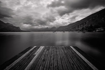 Pier over lake against sky