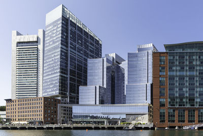 Low angle view of modern buildings against sky in city