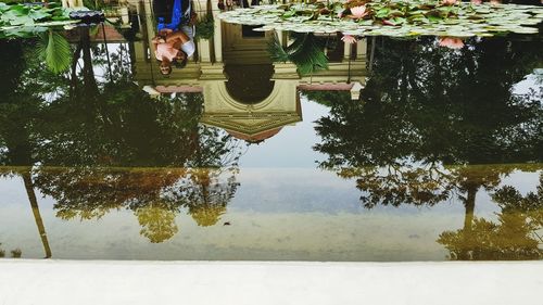 Low section of woman by lake