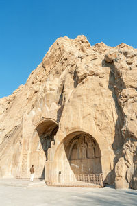 View of rock formation against clear blue sky