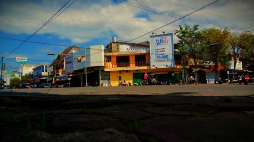 Vehicles on road against buildings in city