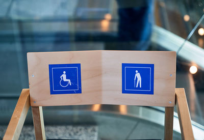 High angle view of disabled sign on chair