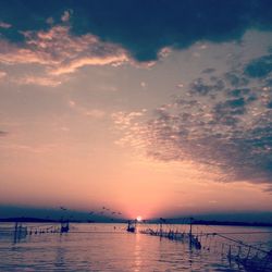 Scenic view of sea at sunset