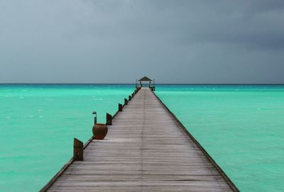 Scenic view of pier amidst sea