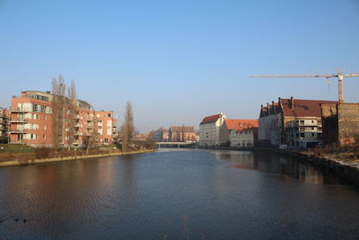 River by city against clear sky