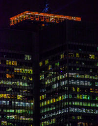 Low angle view of illuminated buildings at night