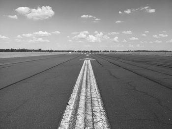 Airport runway against sky