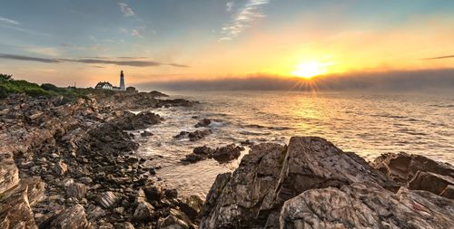 Scenic view of sea against sky during sunset