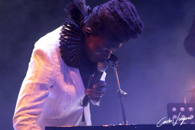 Full length of man playing at music concert