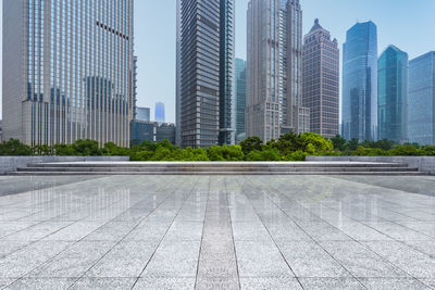 Modern buildings in city against sky