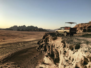 Scenic view of desert against clear sky