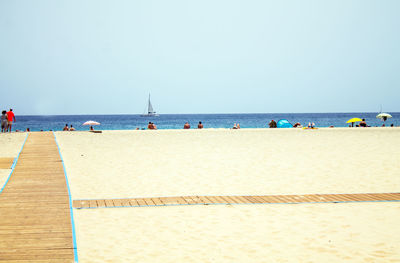 Scenic view of beach against clear sky